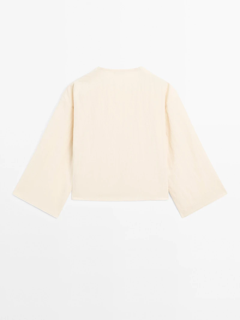 Long sleeve blouse with side button fastening