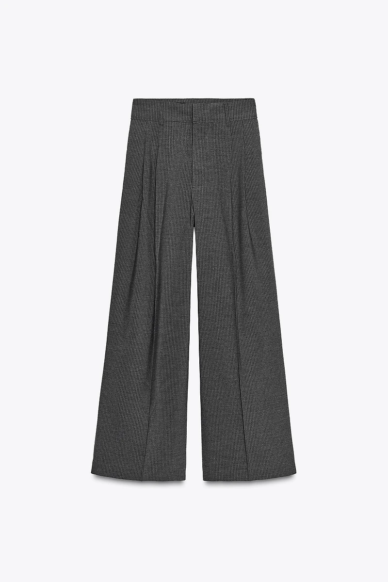 PANTALON À PINCES ET RABATS