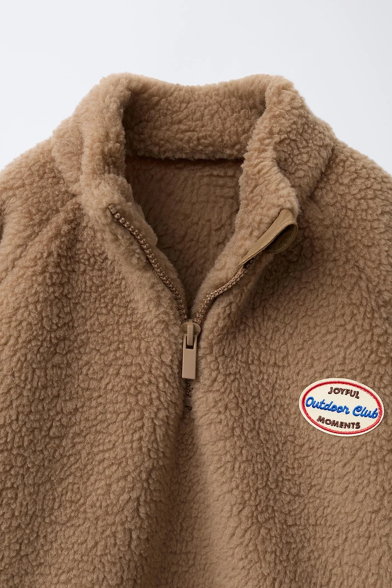FAUX SHEARLING LABEL SWEATSHIRT