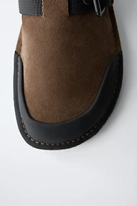 BUCKLED CLOGS