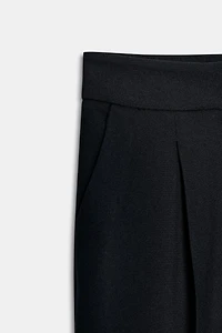 PLEATED PANTS WITH CUFFED HEM