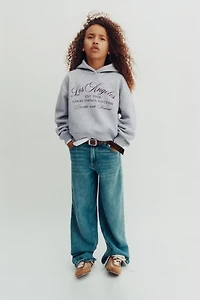 VARSITY DOUBLE HEM HOODED SWEATSHIRT