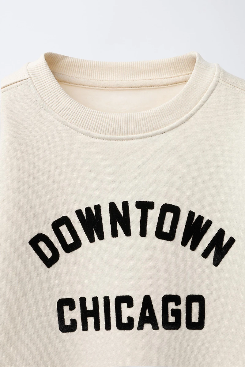 SWEAT À INSCRIPTION FLOQUÉE