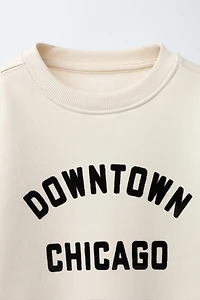 SWEAT À INSCRIPTION FLOQUÉE