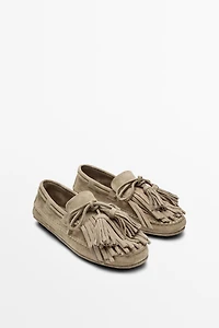 Leather loafers with fringing and tassels