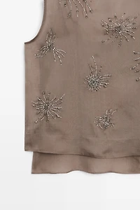 Semi-sheer top with embroidered detail