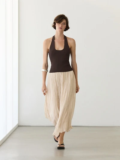 Flowing midi skirt with pleated detail