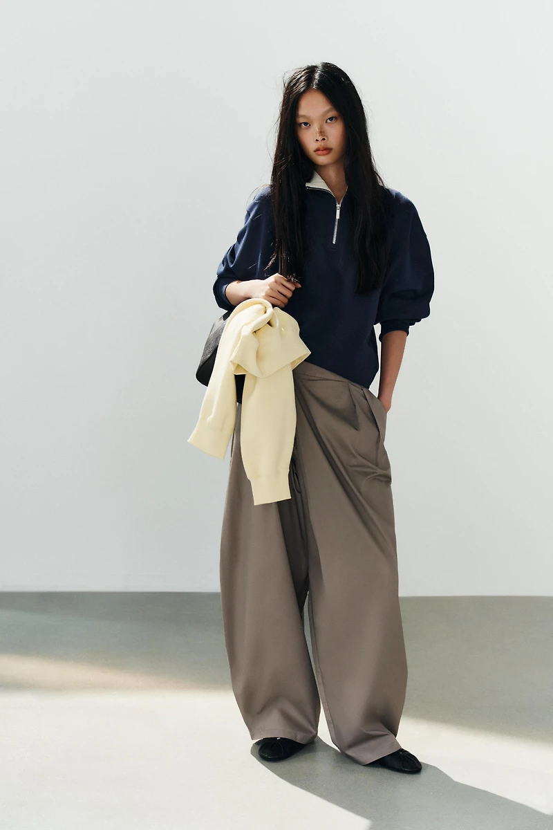 ASYMMETRIC WAIST PLEATED TROUSERS