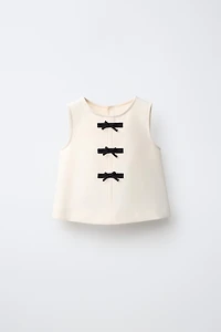 BOW APPLIQUÉ TOP