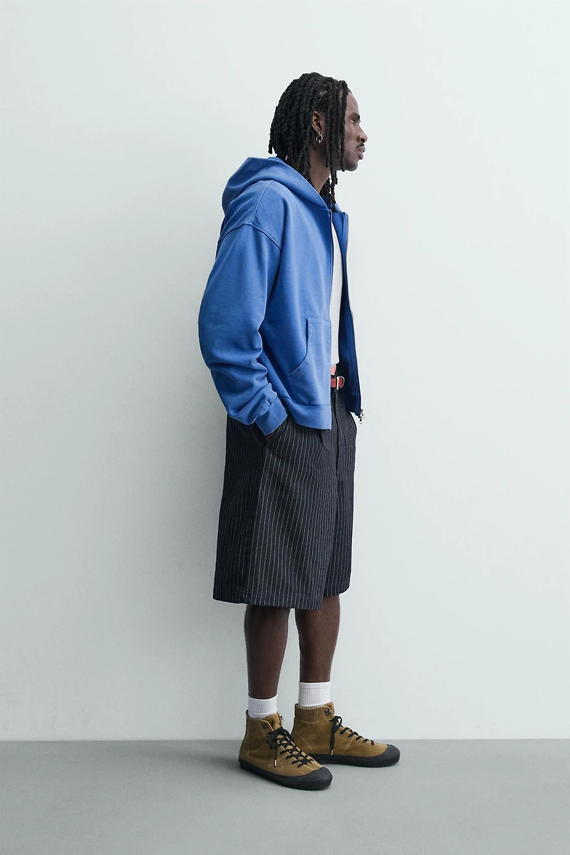 PINSTRIPED PLEATED SHORTS