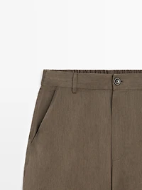 Flowing trousers with elasticated waistband