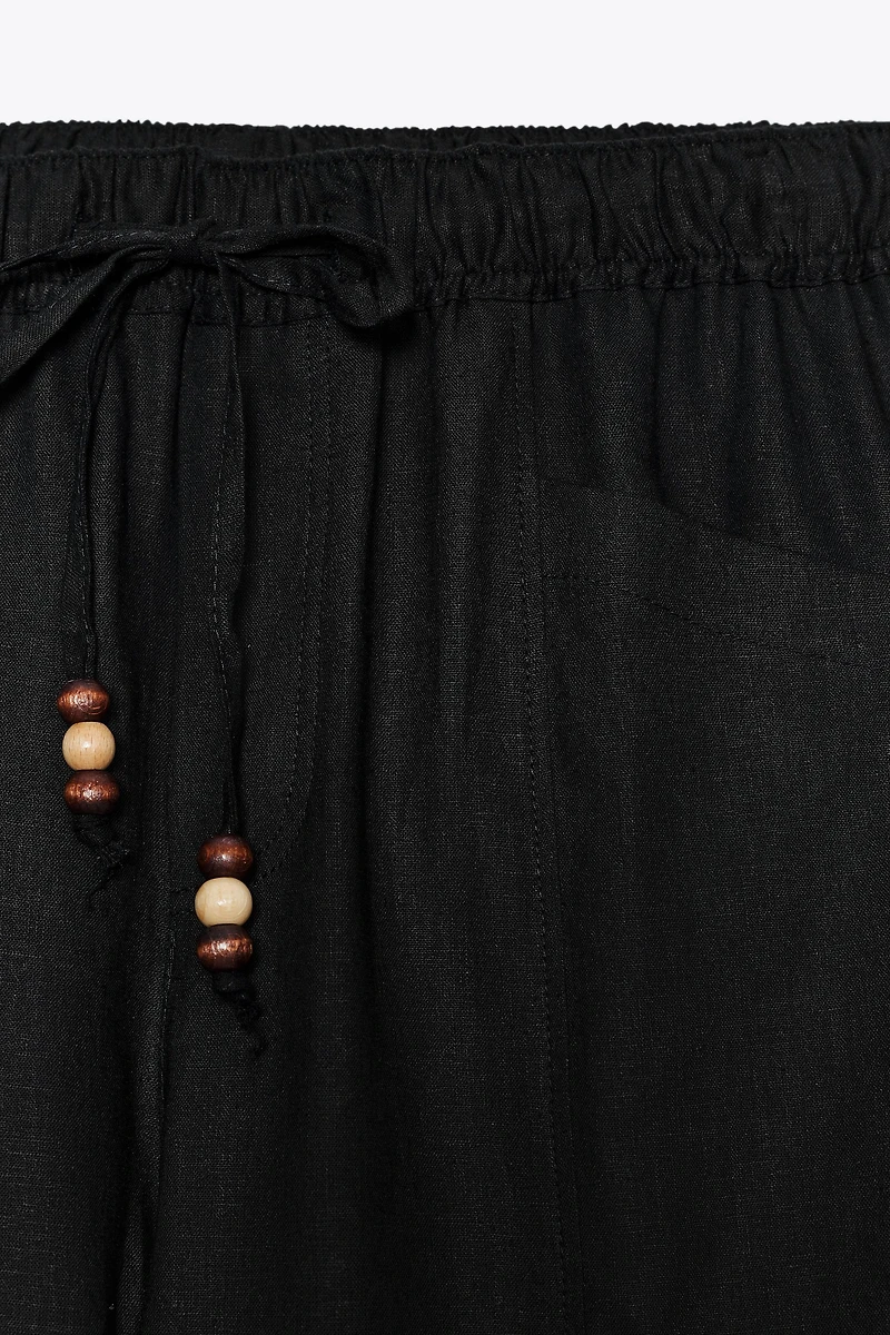 LINEN PANTS WITH BEADED DRAWSTRINGS