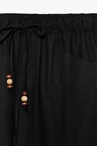 LINEN PANTS WITH BEADED DRAWSTRINGS