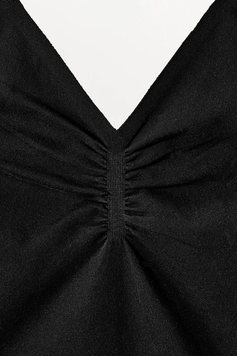 STOCKING-STYLE STRAPPY BODYSUIT