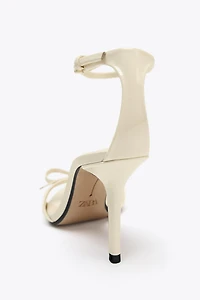 BOW HEELED SANDALS