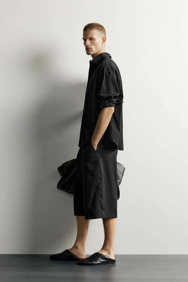 WIDE FIT PLEATED BERMUDA SHORTS