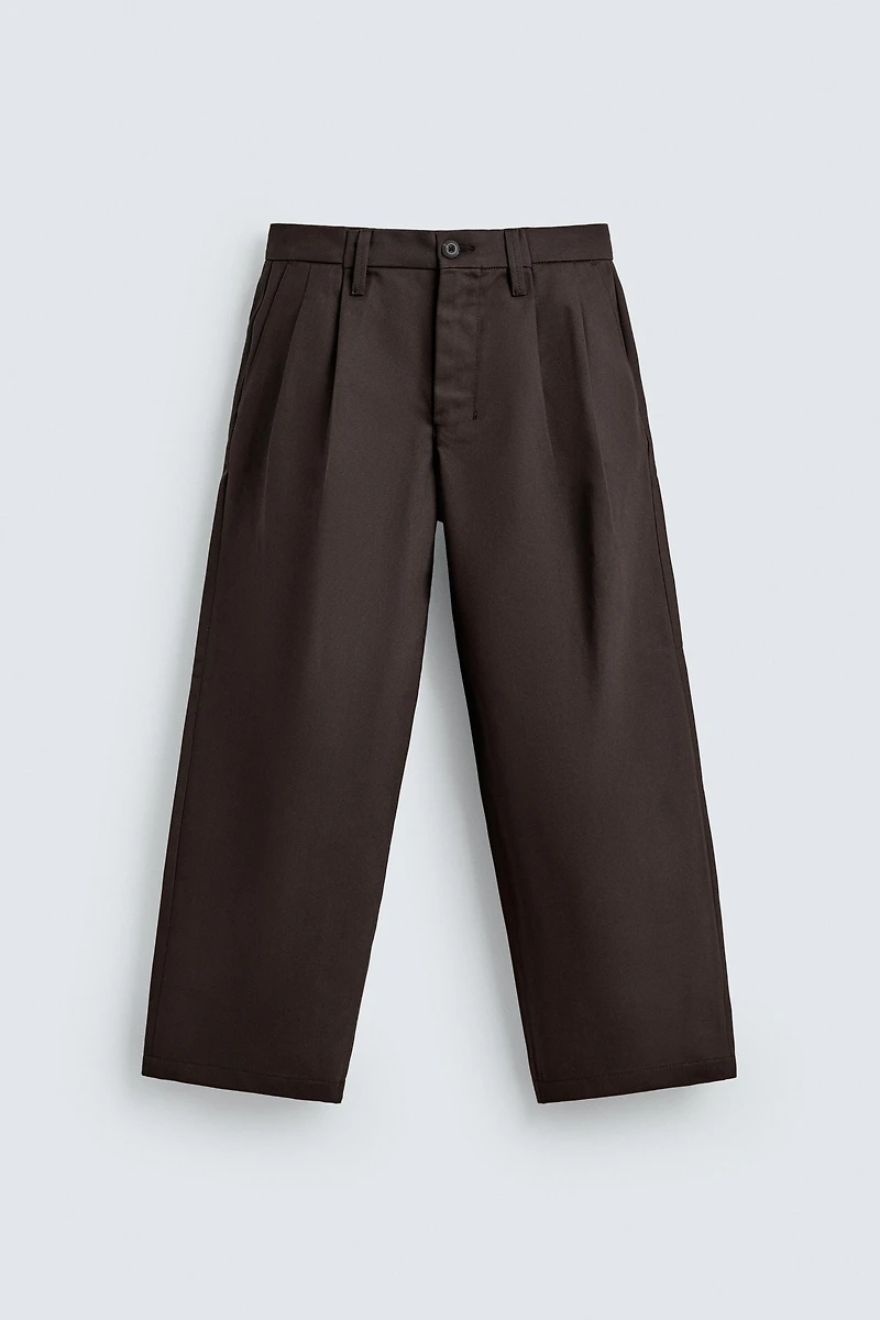 PLEATED CHINO PANTS