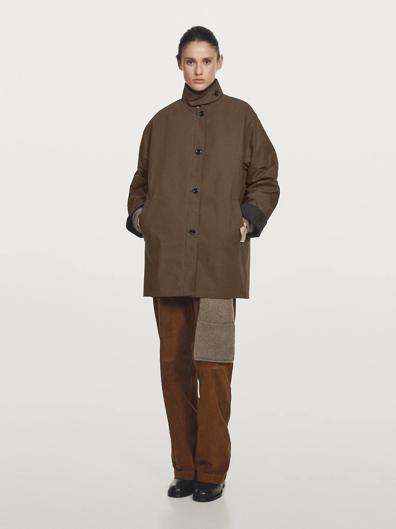 Waxed high neck parka with corduroy detail