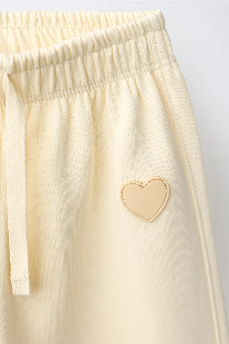 RUBBERIZED HEART INTERLOCK BARREL PANTS