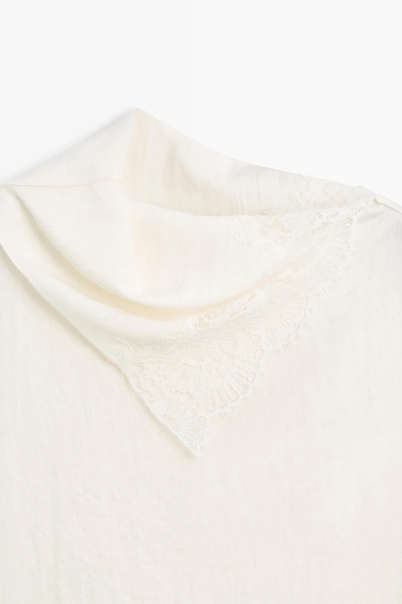 Asymmetric roll neck top with lace detail