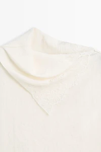 Asymmetric roll neck top with lace detail