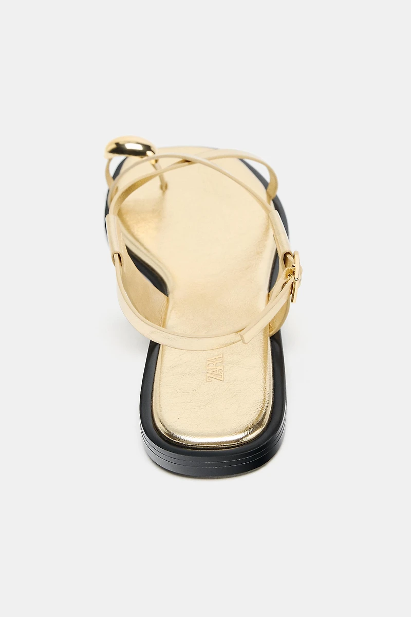 FLAT SANDALS WITH METALLIC DETAIL STRAPS