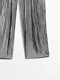 Flowing metallic trousers with gathered detail