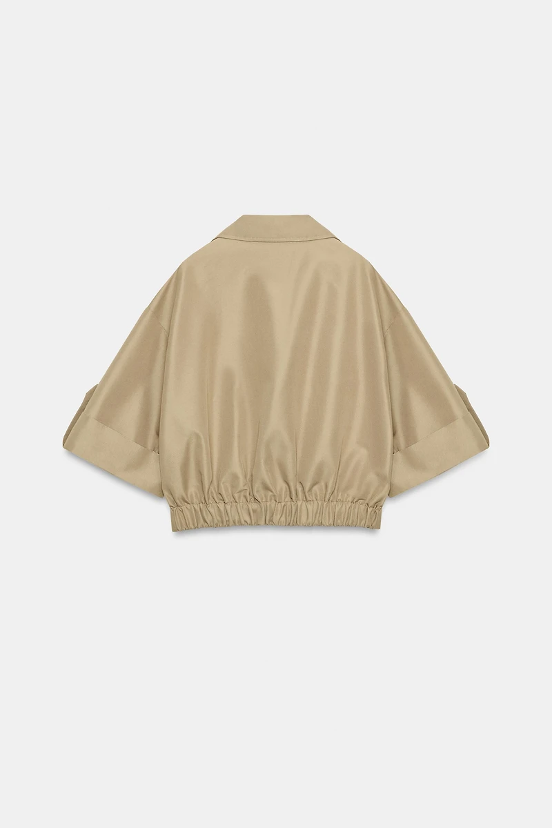 SHORT TRENCH WITH ROLLED SLEEVES