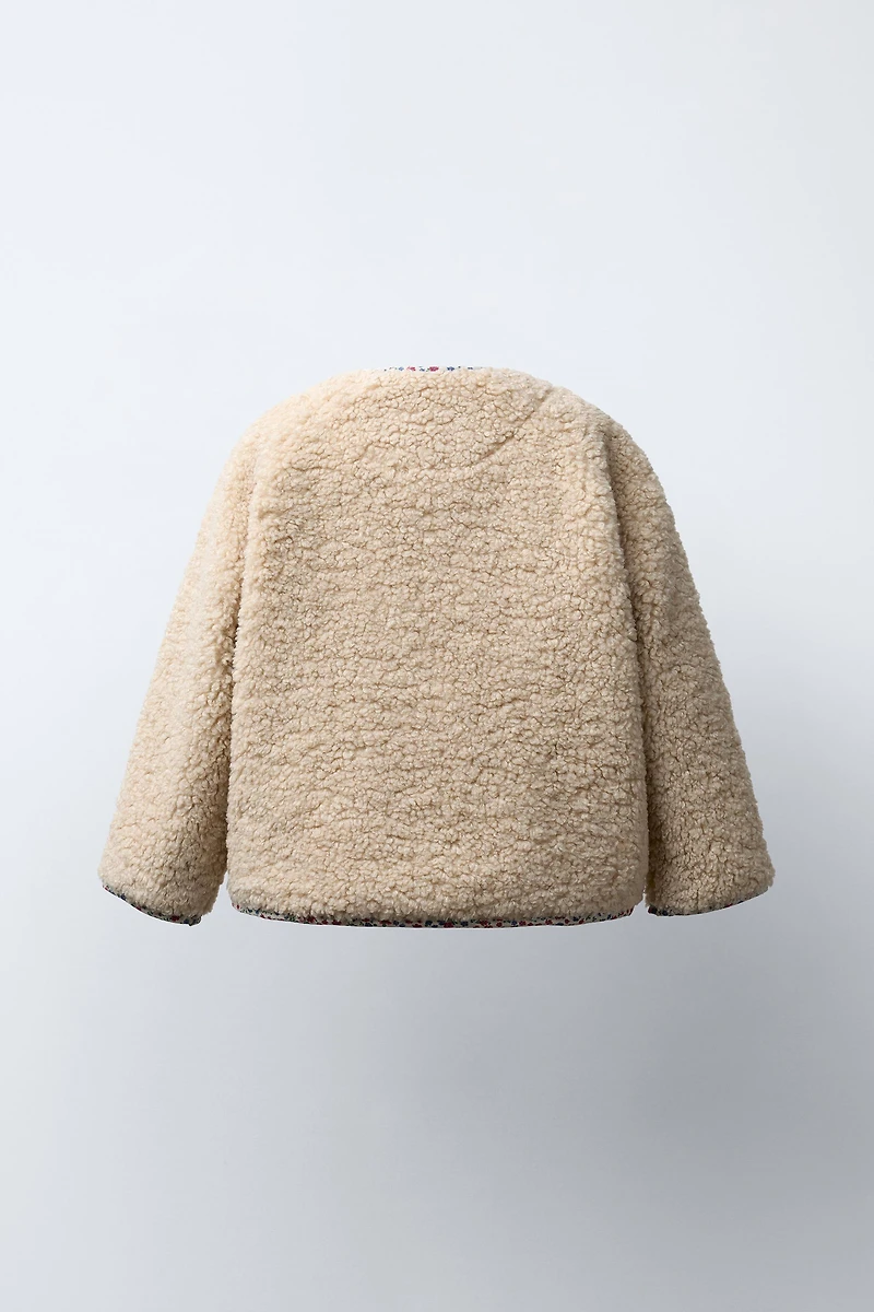 FLEECE JACKET WITH FLORAL TRIM