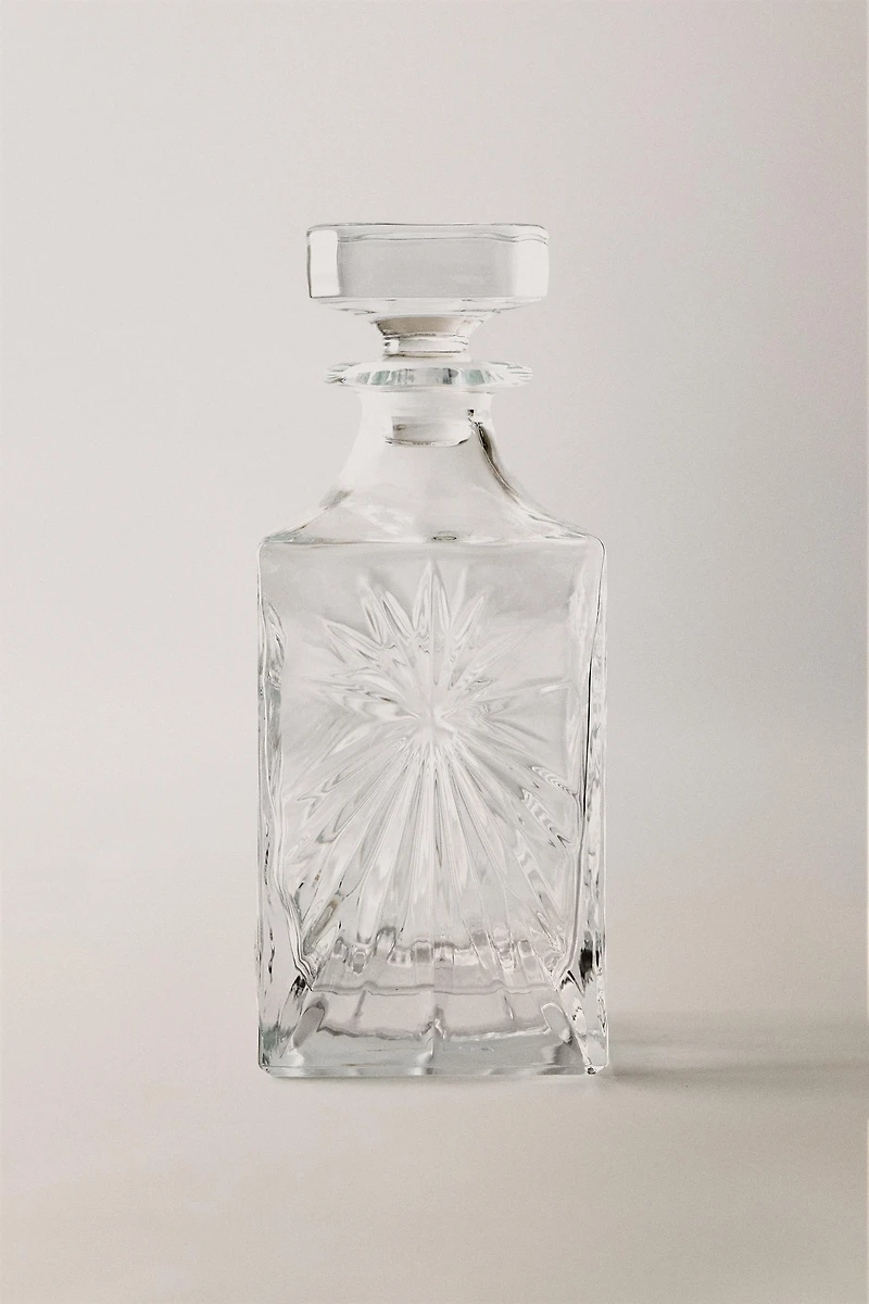 CRYSTALLINE BOTTLE WITH RAISED DESIGN