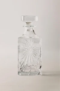 CRYSTALLINE BOTTLE WITH RAISED DESIGN