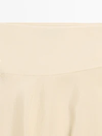 Flowing asymmetric midi skirt