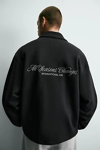 SWEAT COL ZIPPÉ INSCRIPTIONS