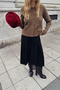 GILET EN MAILLE À BOUTON REVÊTU