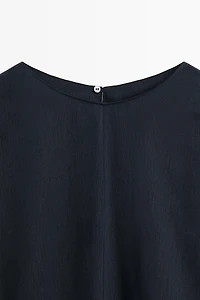 Asymmetric flowing cape