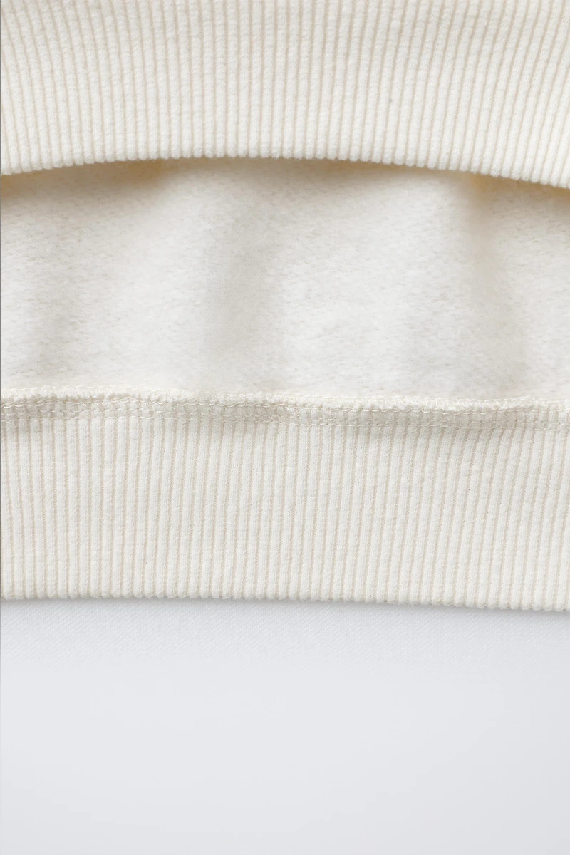 FAUX SHEARLING REINDEER PATCH SWEATSHIRT