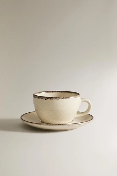 STONEWARE TEACUP AND SAUCER