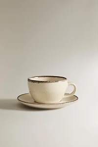 STONEWARE TEACUP AND SAUCER