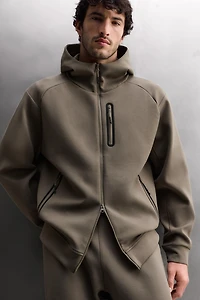 SWEAT TECHNIQUE ZIPPÉ À CAPUCHE