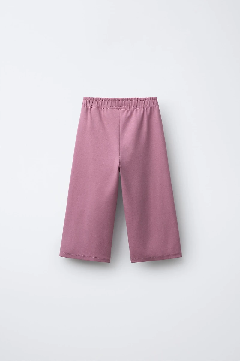 WIDE LEG RAISED TEXT PLUSH PANTS