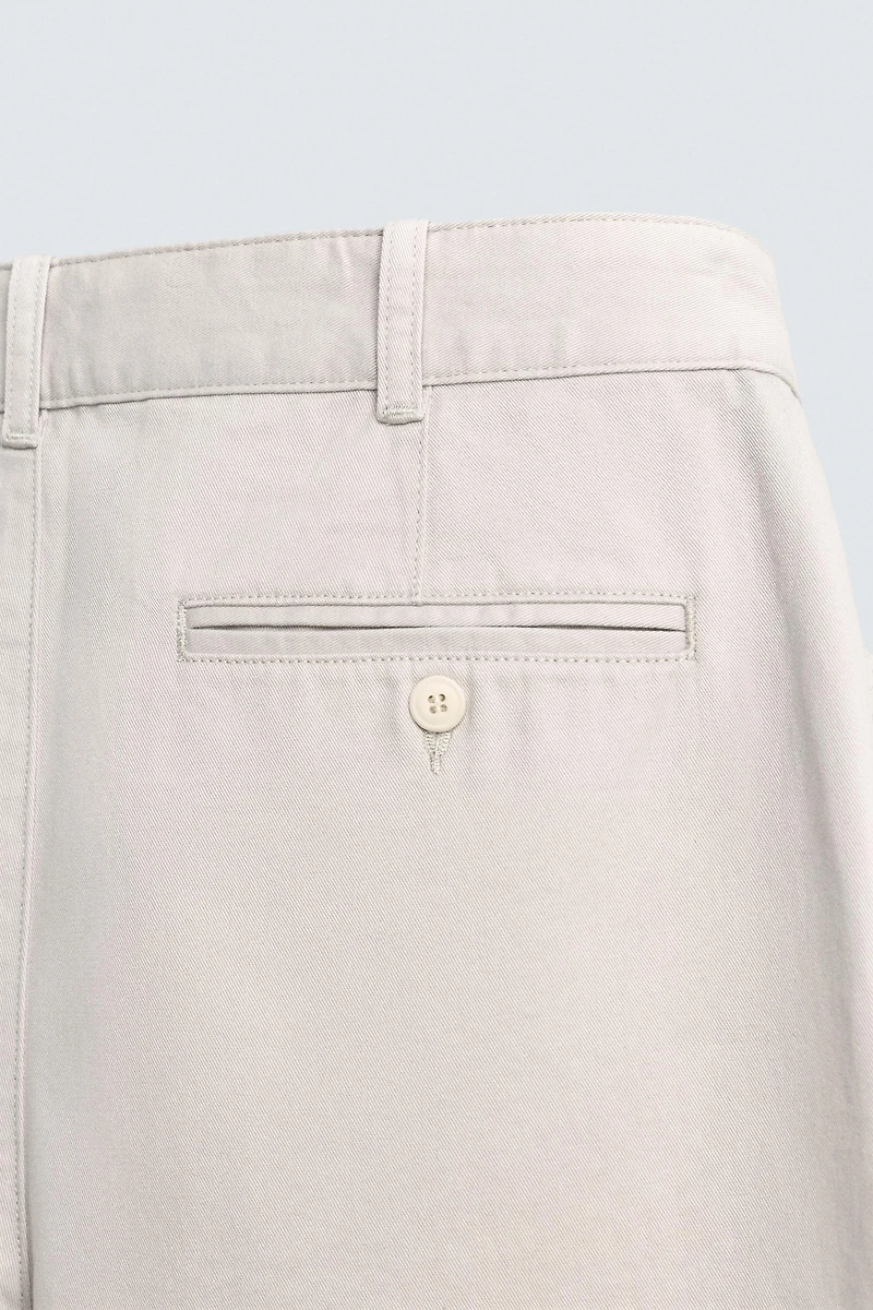 RELAXED FIT PLEATED PANTS