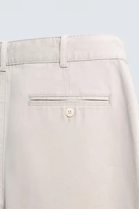 RELAXED FIT PLEATED PANTS