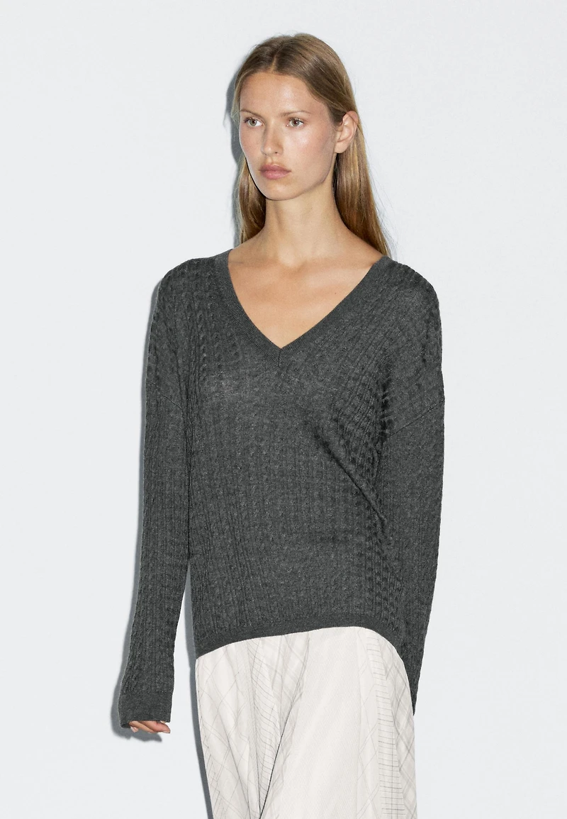 V-neck cable-knit sweater