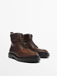 Lace-up leather boots with lined interior