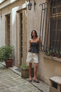 TOP PÉPLUM BUSTIER À POIS