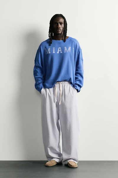 STRIPED WIDE FIT PANTS