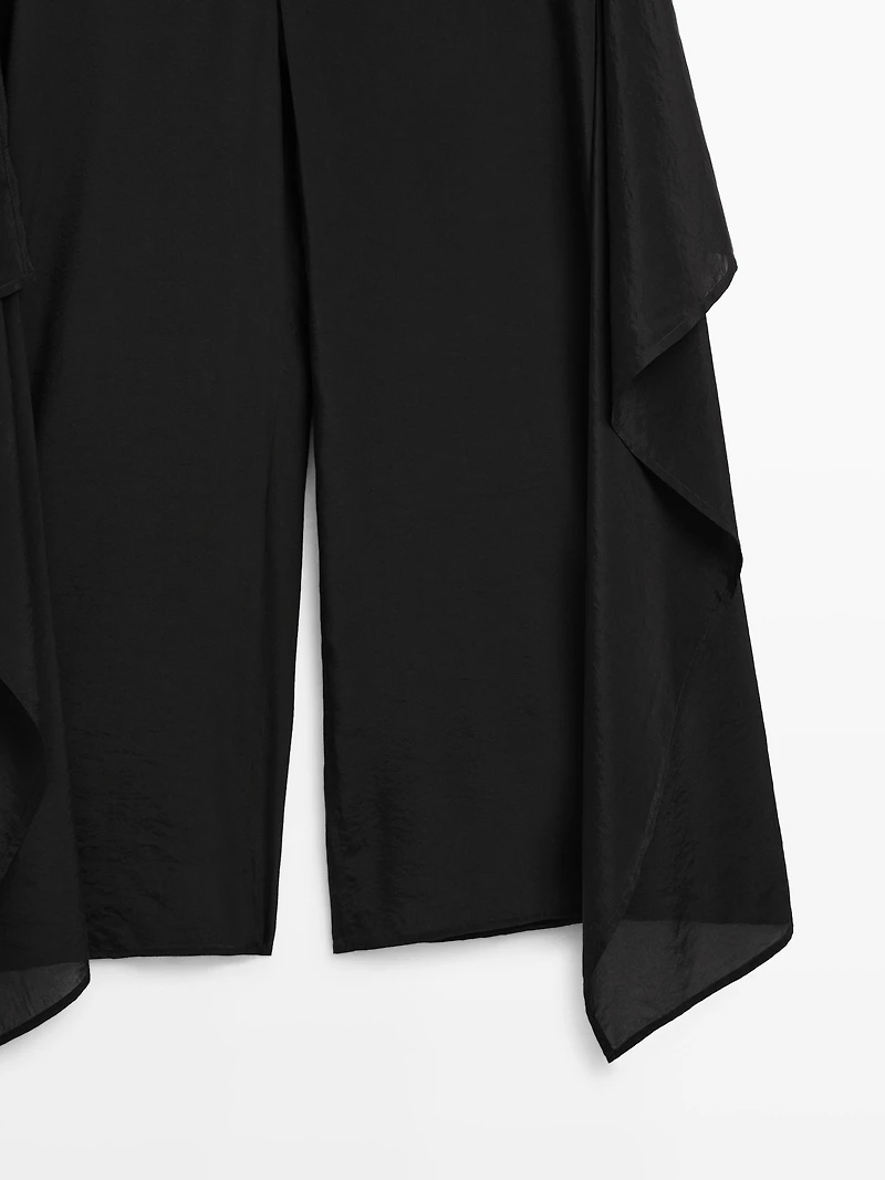 Flowing jumpsuit with knot detail