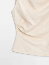 Asymmetric top with knot detail