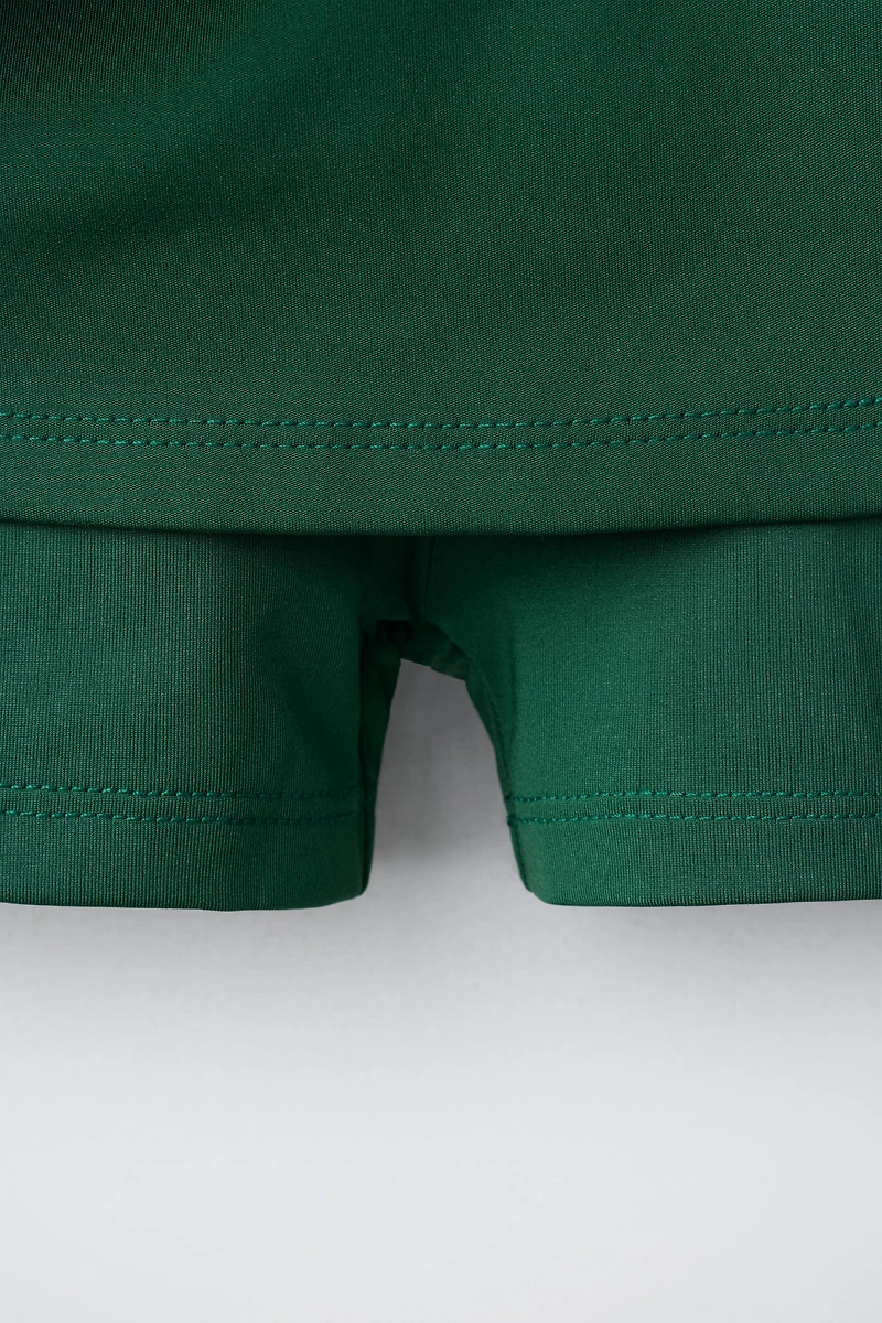CONTRAST PIPING BOX PLEAT SKIRT