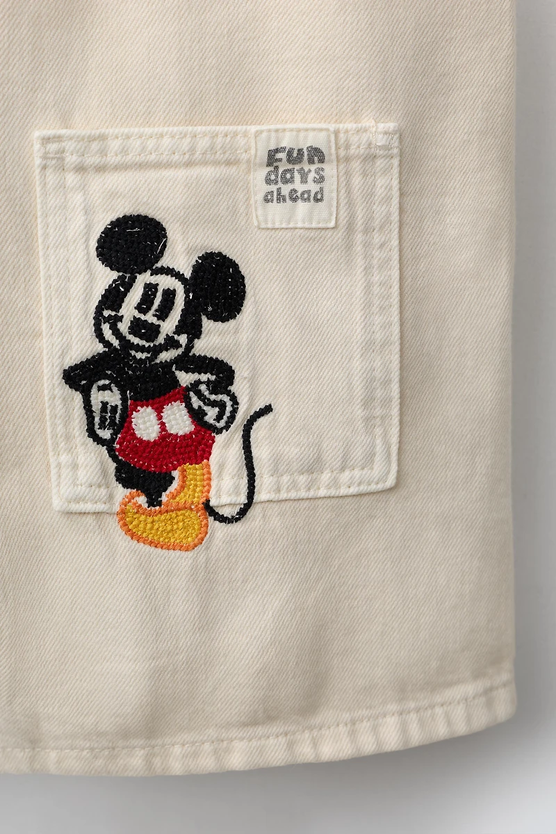 SALOPETTE COURTE EN SERGÉ BRODERIES MICKEY MOUSE © DISNEY